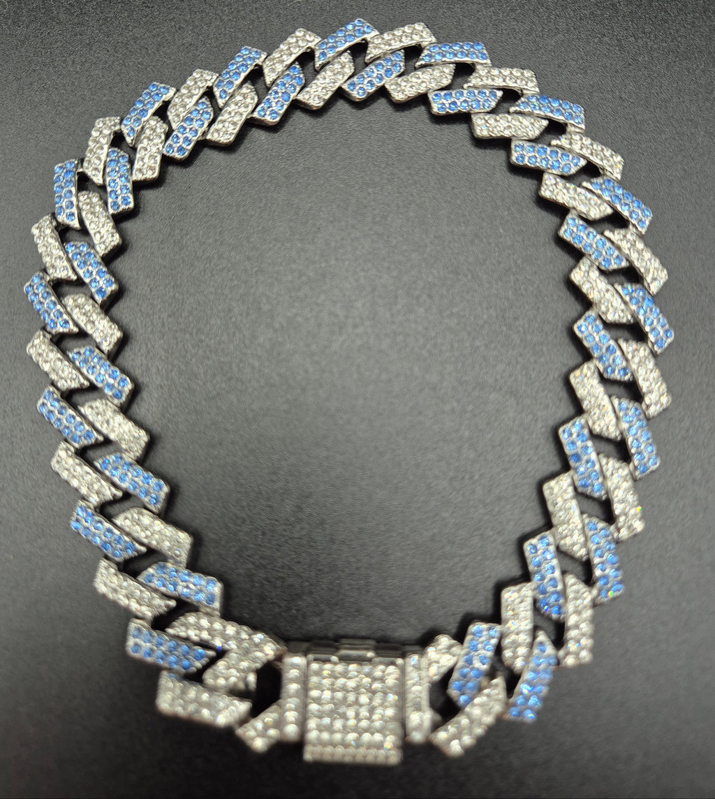 Silver chain necklace on a dark background